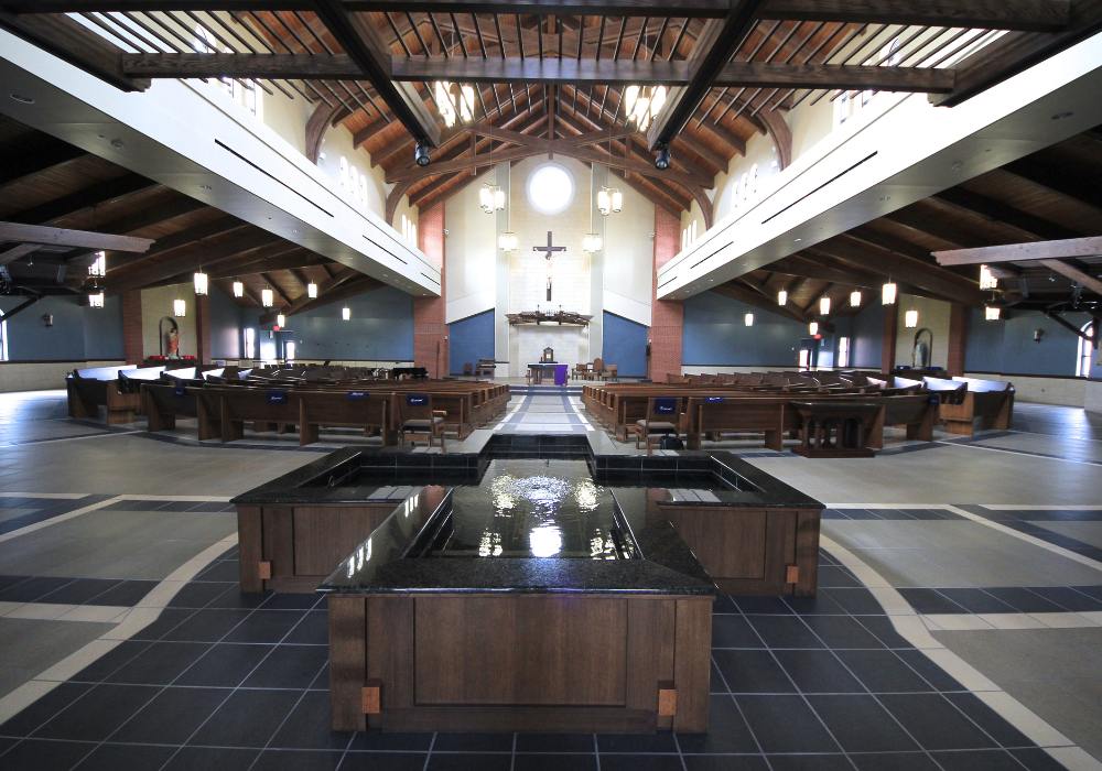 church interior with pews and vaulted ceiling