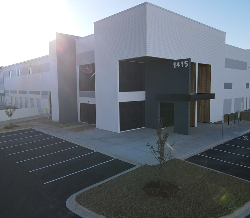 Exterior of a warehouse building with modern front door