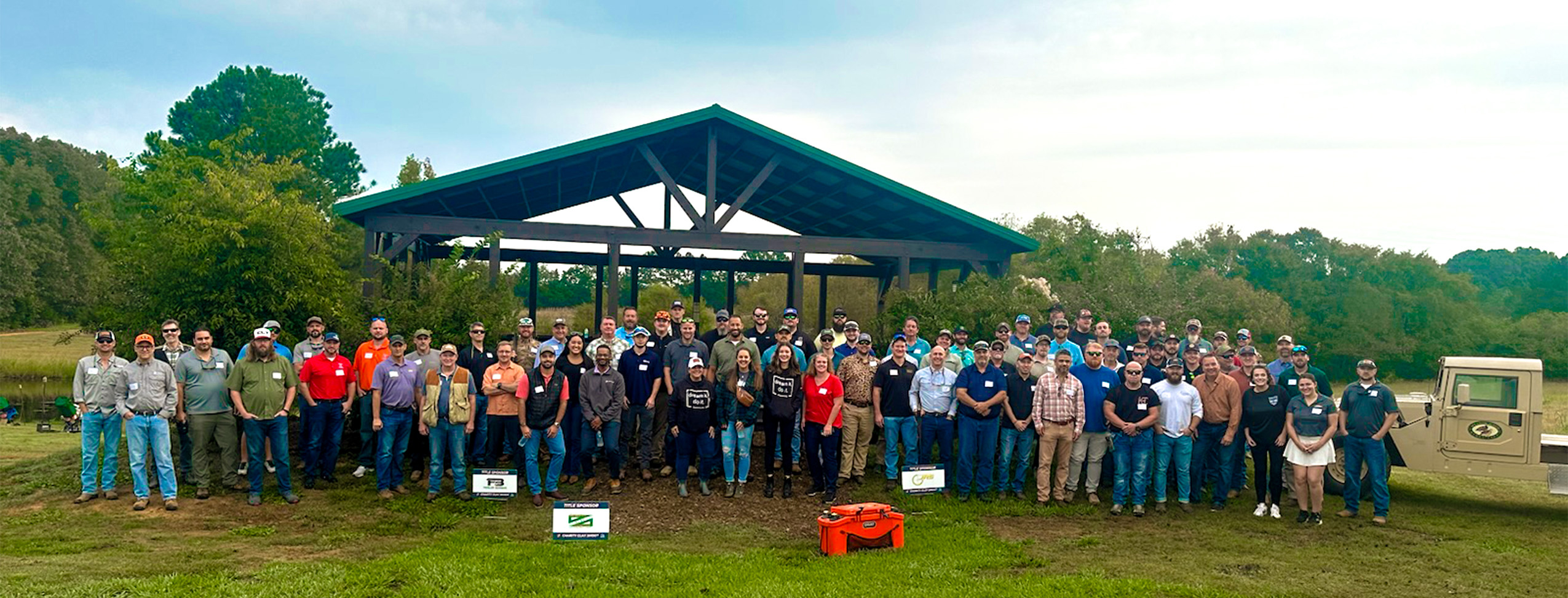 A large group of people standing in front of a pavilion