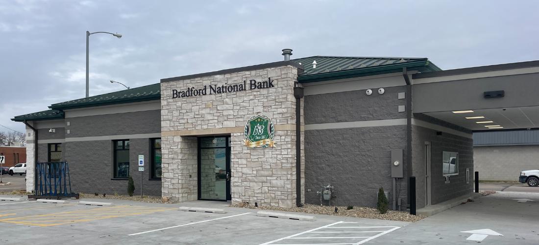 Exterior of a bank with a stone entrance