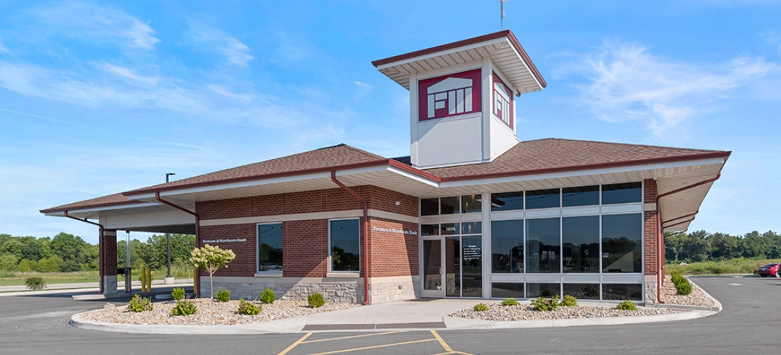 Exterior of a bank with a drive-thru and short tower