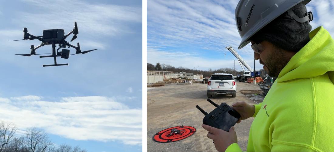 A drone in the sky next to a man holding a remote control