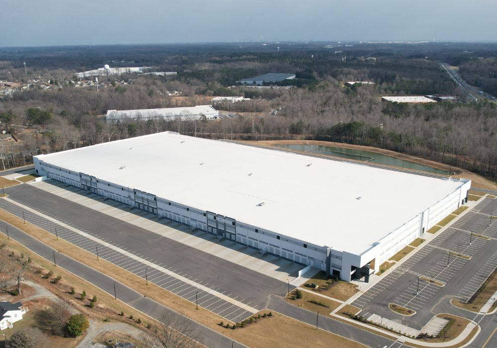 Aerial view of a large white distribution center