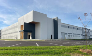 Exterior of the entrance to a large white distribution center