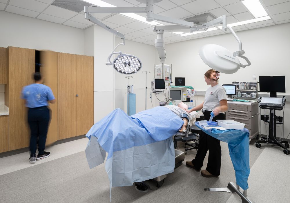surgical room with students working on a patient