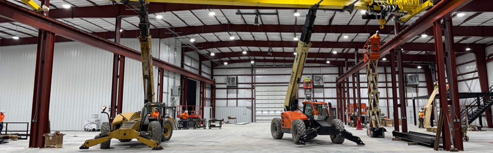 Subcontractor_Header_TDK Construction equipment in a large warehouse