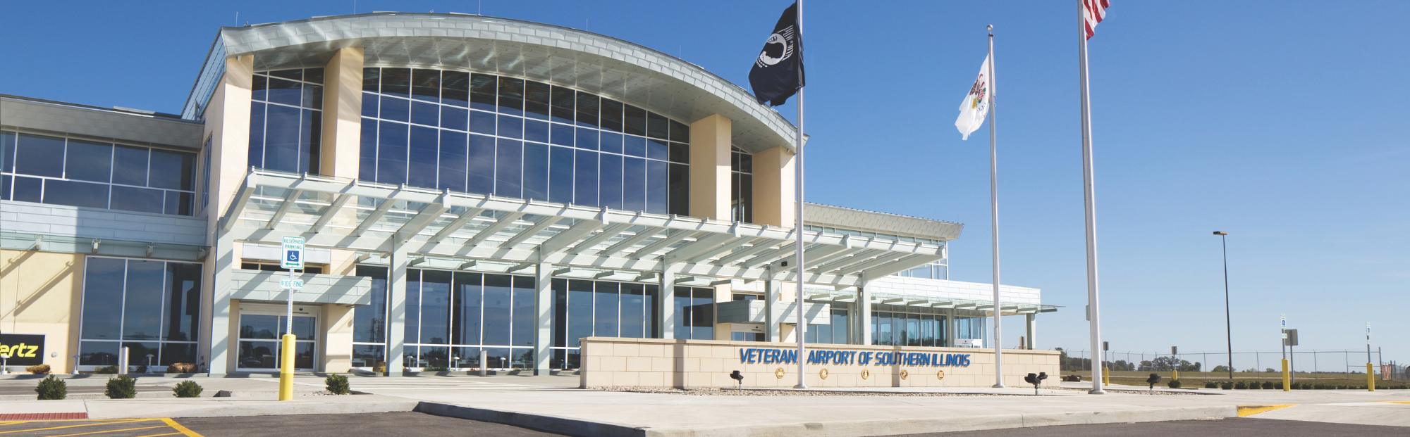 Veterans Airport So. IL_Website Hero_2000x621 Building with a sign saying "Veterans Airport of Southern Illinois"