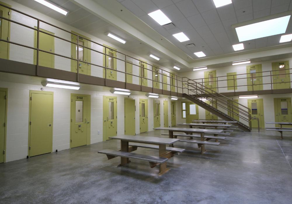 Williamson County Jail_Website Body_1000x700 Jail facilities with many yellow doors and tables in the middle