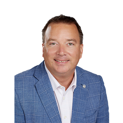 Headshot of man in a blue blazer