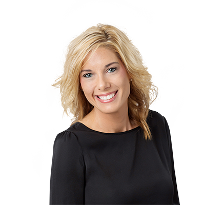 A blond female wearing a black shirt