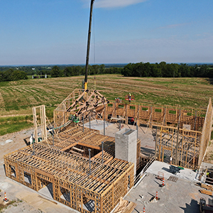 Construction workers setting wood framing for a new building