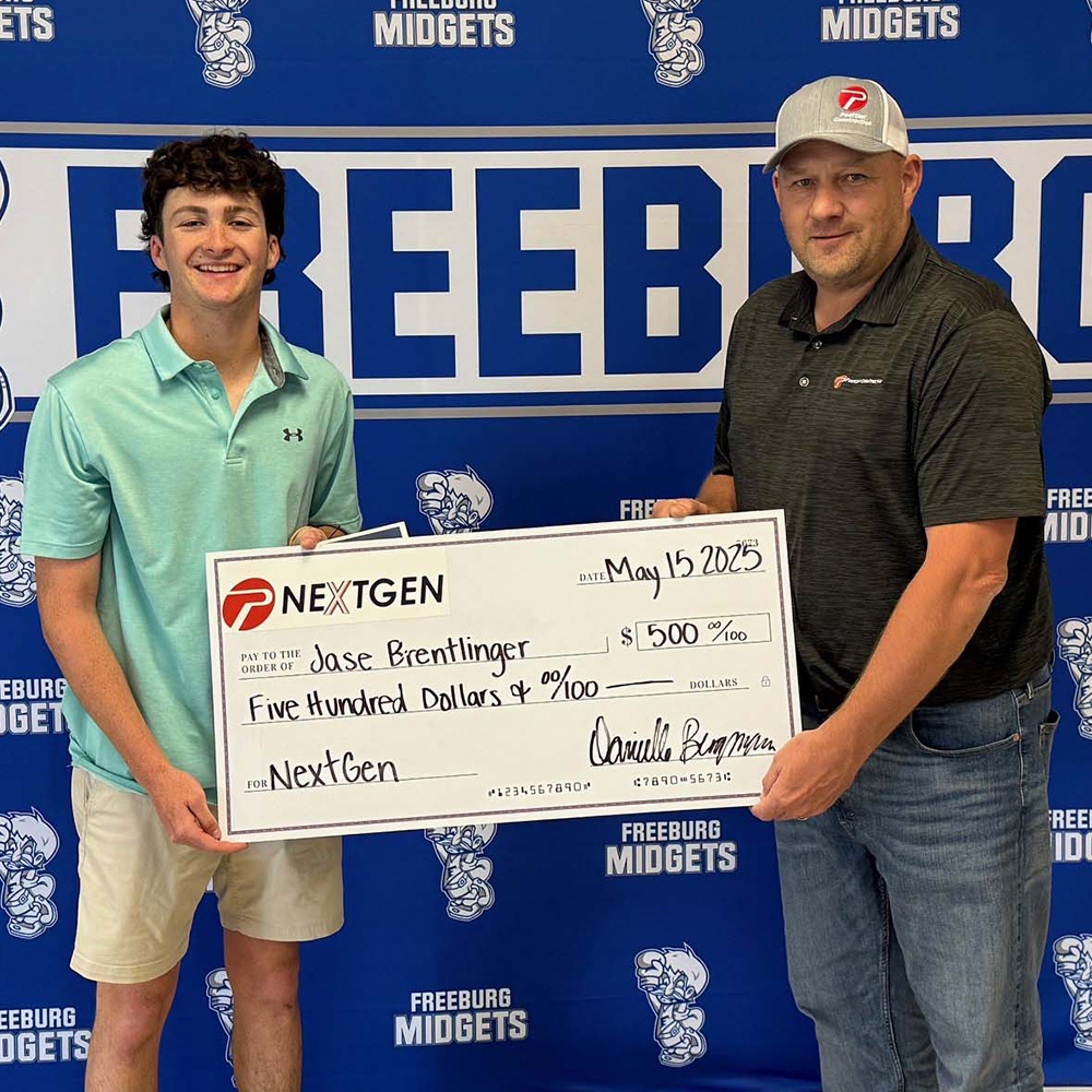 2025_901 NG Scholarship_Freeburg HS_Jase Brentlinger A high school student receives an oversized check for $500 from a man in a Poettker Construction shirt
