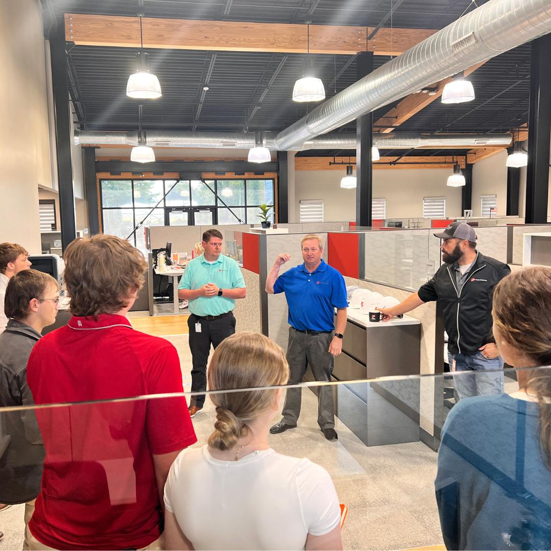 High school students on a tour of a corporate building