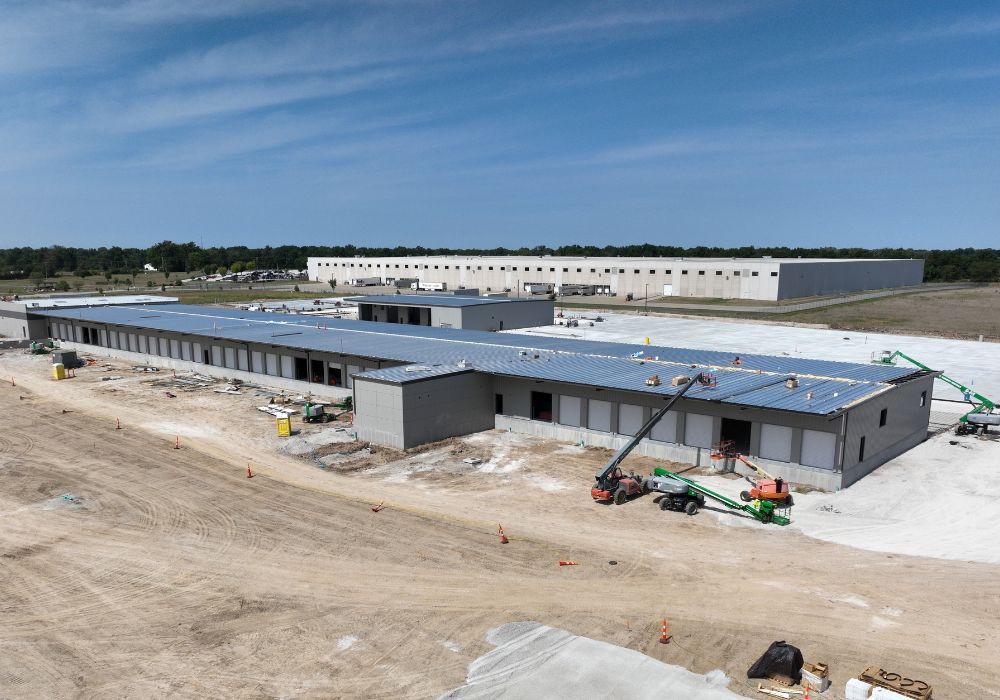 Aerial view of a distribution center surrounded by dirt