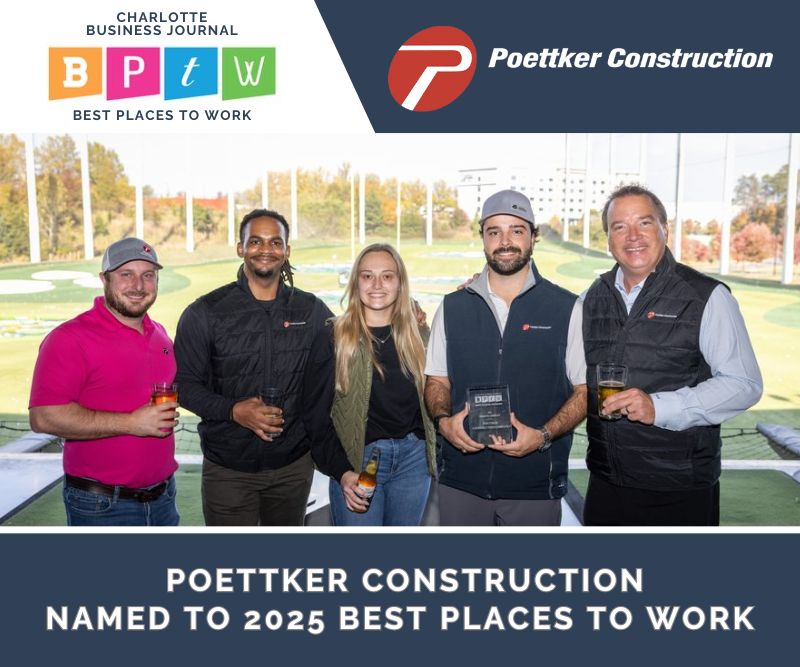 Four men and woman pose with a glass award at a Top Golf
