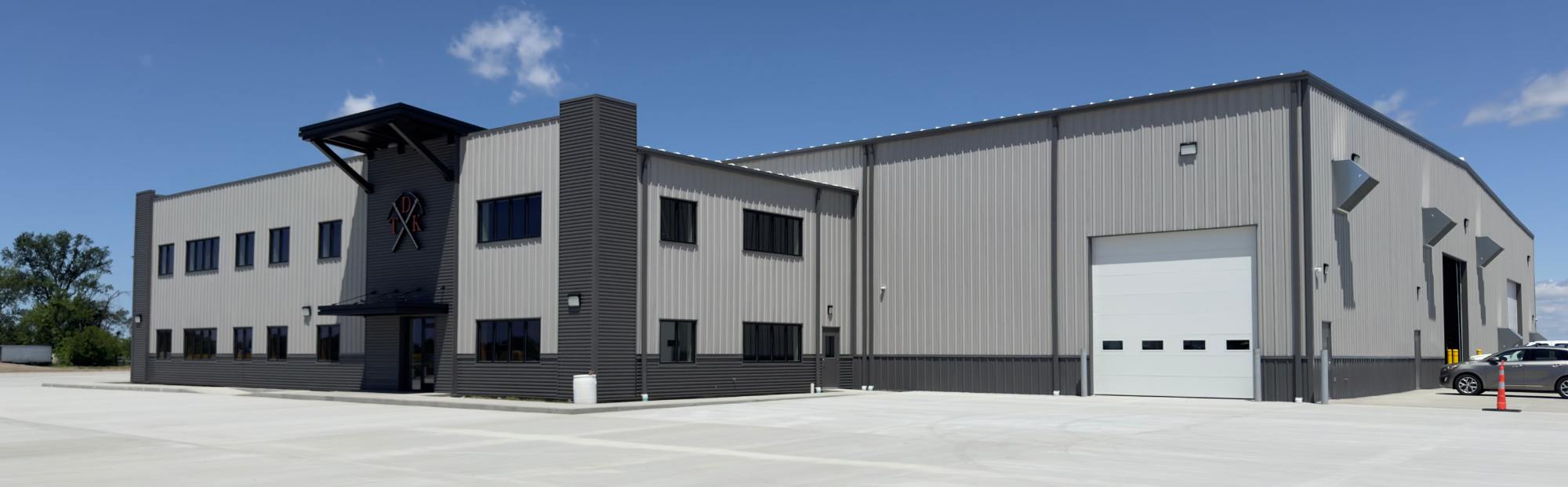 TDK Office_Website Hero_2000x621 gray two-story metal building