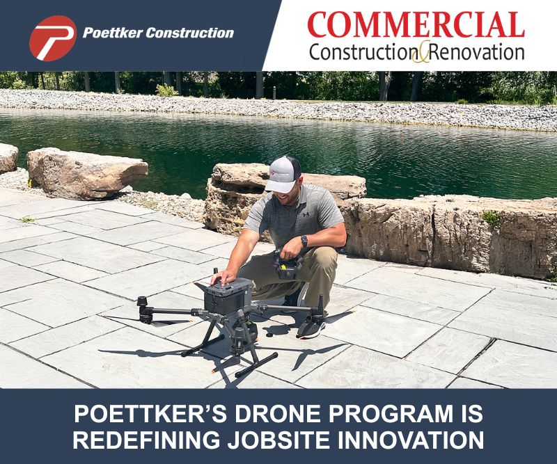 A man crouched next to a drone