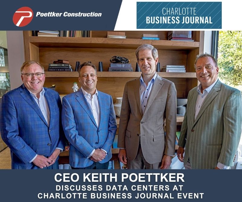 Four smiling men in sports coats