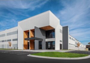 Exterior of the entrance to a large white distribution center