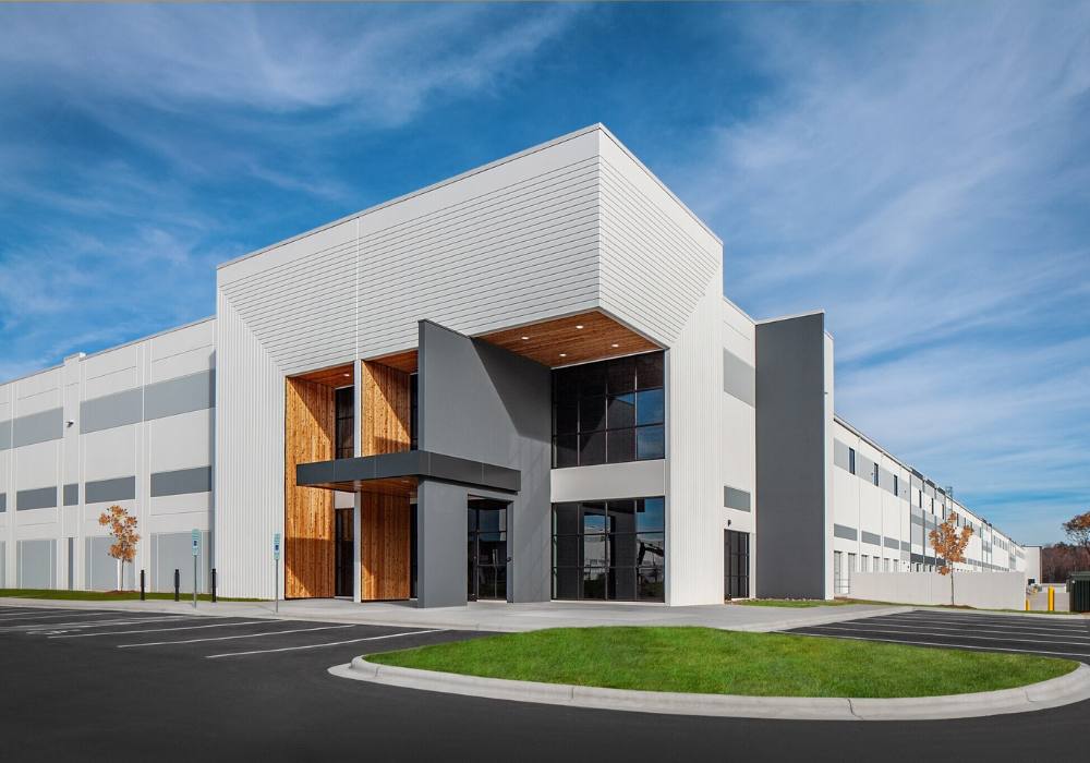 Exterior of the entrance to a large white distribution center