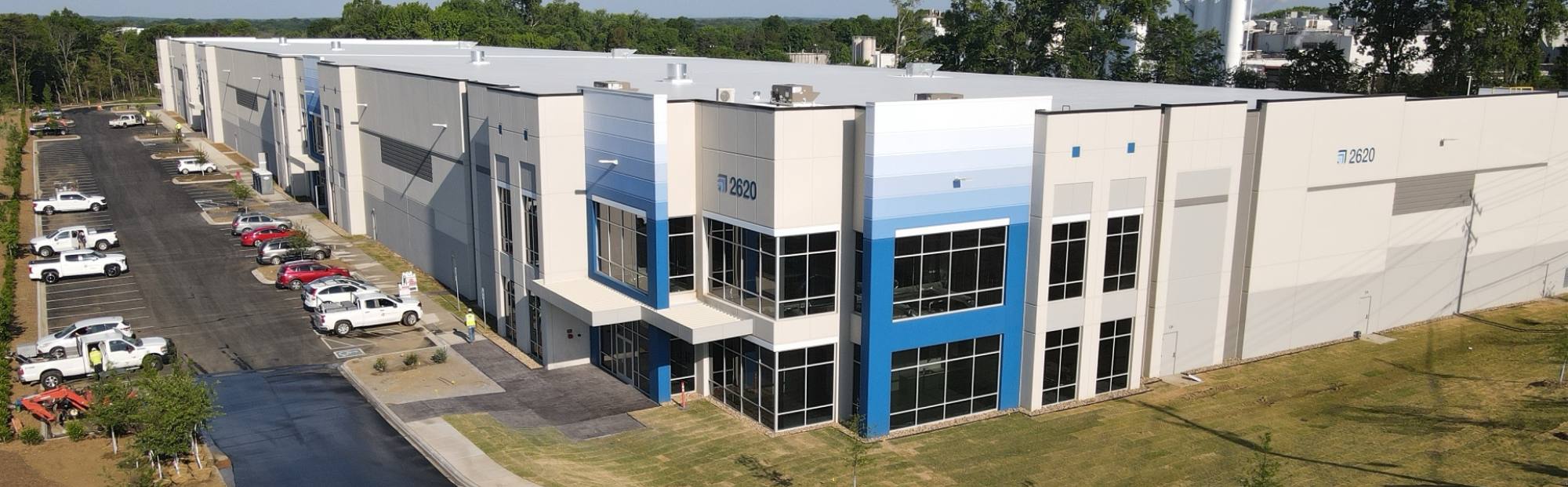gray and blue distribution warehouse building