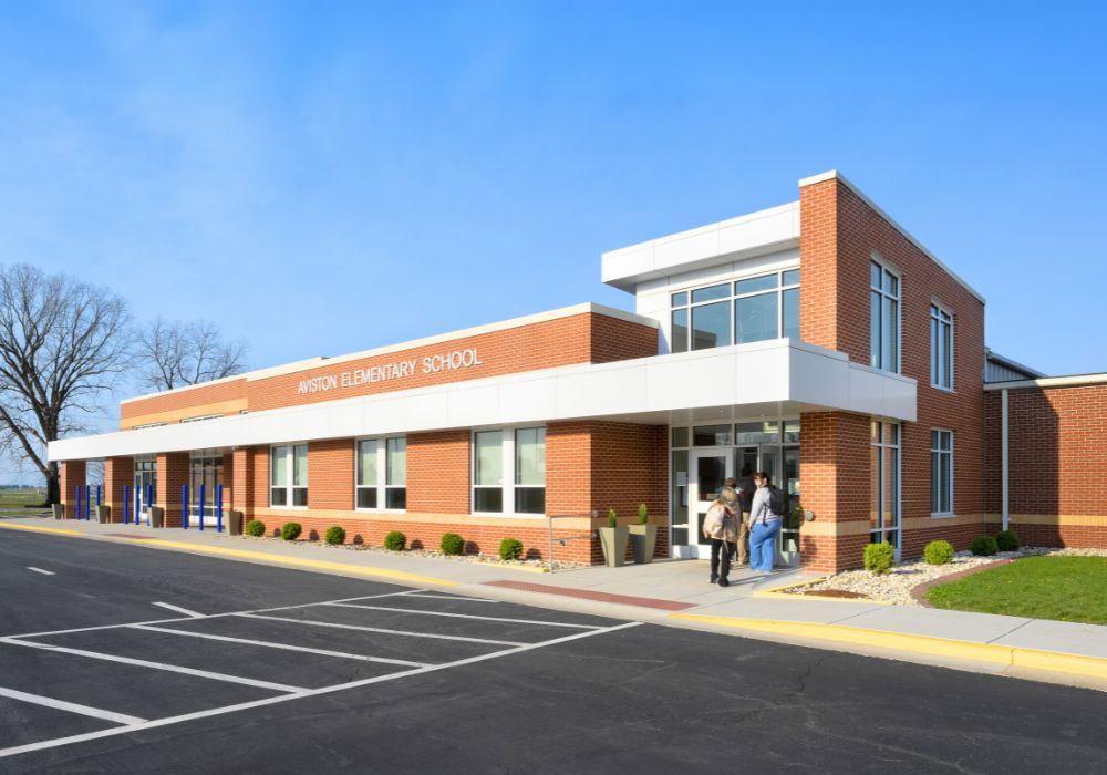 long brick elementary school building front entrance