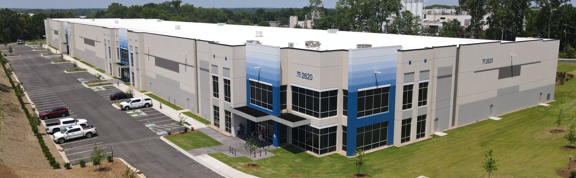 Nevada Logistics Center_Website Hero_2000x621 gray and blue distribution warehouse building