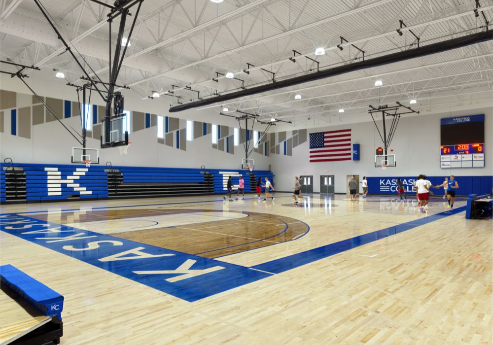 KC Gym Add_Website Body_1000x700 (2) Gymnasium with blue bleachers