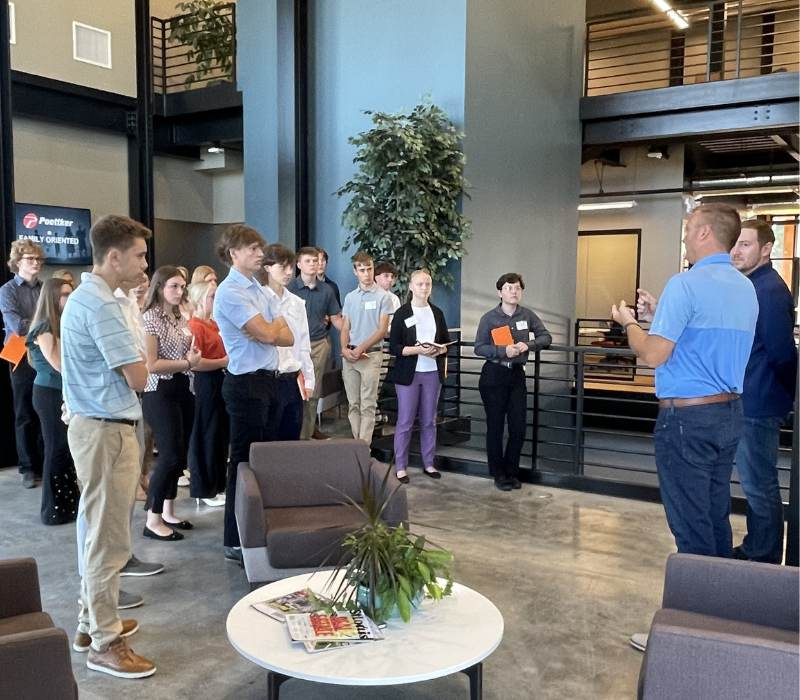 Student participants of Clinton County CEO tour the headquarters of Poettker Construction.