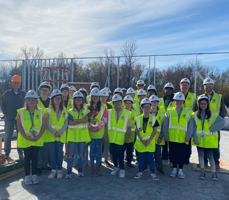 Students from Poettker's NextGen program tour a construction site.